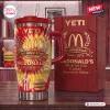 Front view of the McDonald's 86th Anniversary YETI Handle Tumbler featuring red and yellow flames and matching gift box.