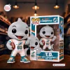 Front view of the Miami Dolphins TD Mascot 60th Anniversary Vinyl Figure standing next to its branded box.