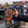Hand holding a Mike Ditka Da Coach Chicago Bears Tumbler with a handle and straw.