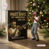 Hanging Miles Davis 100th Anniversary Resin Ornament next to its branded black gift box.