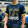 Front view of a fan wearing a blue Milwaukee Brewers 2026 Champions shirt at a stadium.