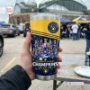 Hand holding Milwaukee Brewers 2026 National League Champions Tumbler Cup outdoors.