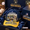 Front view of a blue and yellow baseball cap inside a gift box.