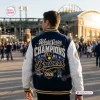 Back view of the Milwaukee Brewers 2026 World Series Champions Baseball Jacket worn outside a stadium.