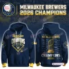 Front and back view of Milwaukee Brewers 2026 World Series Champions blue hoodie with gold graphics.