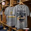 Front and back views of the Milwaukee Brewers 2026 World Series Champions grey baseball jersey hanging in a locker room.