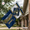 Outdoor view of a Milwaukee Brewers 2026 World Series Champions house flag mounted on a brick house.
