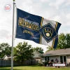 Outdoor view of a Milwaukee Brewers 2026 World Series Champions house flag flying on a pole.