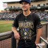 Man wearing a black Milwaukee Brewers 2026 World Series Champions Jersey at a stadium.