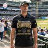 Man wearing Milwaukee Brewers 2026 World Series Champions Polo Shirt at a baseball stadium.
