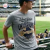 Man wearing gray Milwaukee Brewers 2026 World Series Champions Shirt at a baseball stadium.