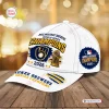 Front and side view of a white Milwaukee Brewers 2026 World Series Champions cap with gold and blue graphics.
