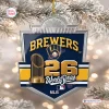 Front view of a blue and gold Milwaukee Brewers 2026 World Series Christmas ornament hanging on a tree.