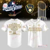 Front and back view of the Milwaukee Brewers 2026 World Series Gold Baseball Jersey featuring championship graphics.