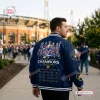 Back view of a person wearing a navy blue Milwaukee Brewers Champions Varsity Jacket outdoors near a stadium.