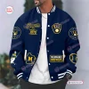 Front view of a blue and yellow Milwaukee Brewers Champions Varsity Jacket worn by a model.