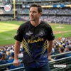 Man wearing Milwaukee Brewers League Champions Baseball Jersey 2026 at a stadium.