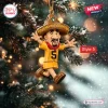 Front view of a Milwaukee Brewers Racing Sausages Christmas Ornament hanging on a snowy tree.
