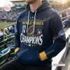 Front view of a blue Milwaukee Brewers World Series Champions Hoodie 2026 worn in a stadium.