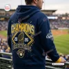 Back view of a fan wearing the Milwaukee Brewers World Series Champions Hoodie 2026 at a stadium.