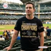 Man wearing Milwaukee Brewers World Series Shirt 2026 at a baseball stadium.