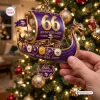 Close-up of Minnesota Vikings 66th Anniversary Viking Ship Christmas Ornament hanging on a tree.