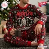 Front view of a person wearing a Motley Crue Red Christmas Holiday Sweater and Jogger Set holding a mug.