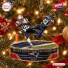 Close-up of a New England Patriots Malcolm Butler Christmas Ornament depicting a goal-line interception on a tree branch.