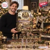 Man holding a New Orleans Saints 59th Anniversary Advent Calendar 2026 box.