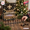 Front view of New Orleans Saints Advent Calendar box with mini figurine set on a wooden table.