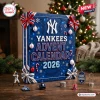 Front view of blue New York Yankees 2026 Advent Calendar with holiday decorations and baseball figurines on a wooden table.