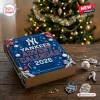 Top view of a blue New York Yankees 2026 Advent Calendar box on a wooden table with team-themed items.