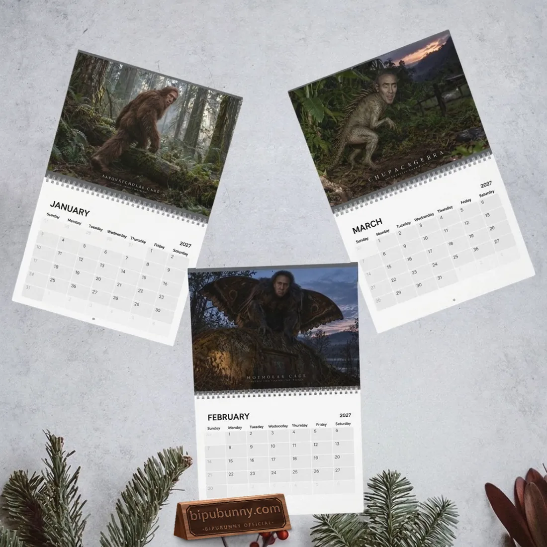 January, February, and March 2027 spreads of the Nicolas Cage Cryptids Wall Calendar featuring Sasquatcholas Cage, Motholas Cage, and Chupacagebra