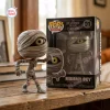Front view of the Nightmare Before Christmas Mummy Boy vinyl figure standing next to its box.