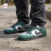 On-feet view of custom Nike sneakers featuring green and metallic silver panels with black laces.