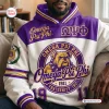 Front view of an Omega Psi Phi bulldog purple white hoodie worn by a man sitting on a couch.
