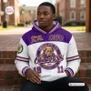 Front view of an Omega Psi Phi bulldog purple white hoodie worn by a man sitting outdoors.