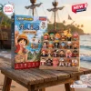 Front view of One Piece Advent Calendar 2026 packaging next to twenty four small collectible figures on a wooden stand.