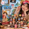 Front view of One Piece Advent Calendar 2026 packaging with twenty-four small figures displayed on wood blocks.