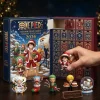 Front view of the 2026 advent calendar with miniature figurines and open holiday box.