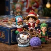 Close-up of One Piece holiday figurines including Luffy in a Santa suit and a snowy globe ornament.