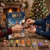 Hands opening a window on the One Piece Straw Hat Crew Grand Line 2026 Advent Calendar box near a Christmas tree.