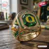 Closeup of Oregon Ducks 132nd Anniversary 1894-2026 Ring featuring a green center stone and mascot.