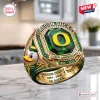 Closeup of the Oregon Ducks 132nd Anniversary 1894-2026 Ring featuring a green center stone and mascot on gold.