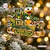 Close-up view of the Oregon Ducks 132nd Anniversary Sleigh Ornament on a tree.