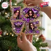 Close-up of an Ozzy Osbourne Purple Love Christmas Ornament hanging on a tree.