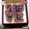 Front view of Ozzy Osbourne Purple Love Christmas Ornament featuring purple and gold letters in a gift box.