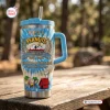 Front view of Peanuts 77th Anniversary YETI Handle Tumbler on a wooden surface outdoors.