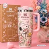 Front view of Peanuts Flora 40oz Tumbler Cup featuring Snoopy with pink flowers and a matching box.