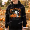 Front view of a black hoodie featuring Snoopy sitting with pumpkins, autumn leaves, and Great Pumpkin 60th Anniversary text.